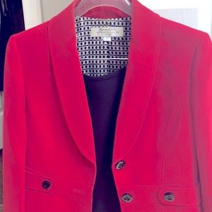 Sexy black skirt with red jacket.